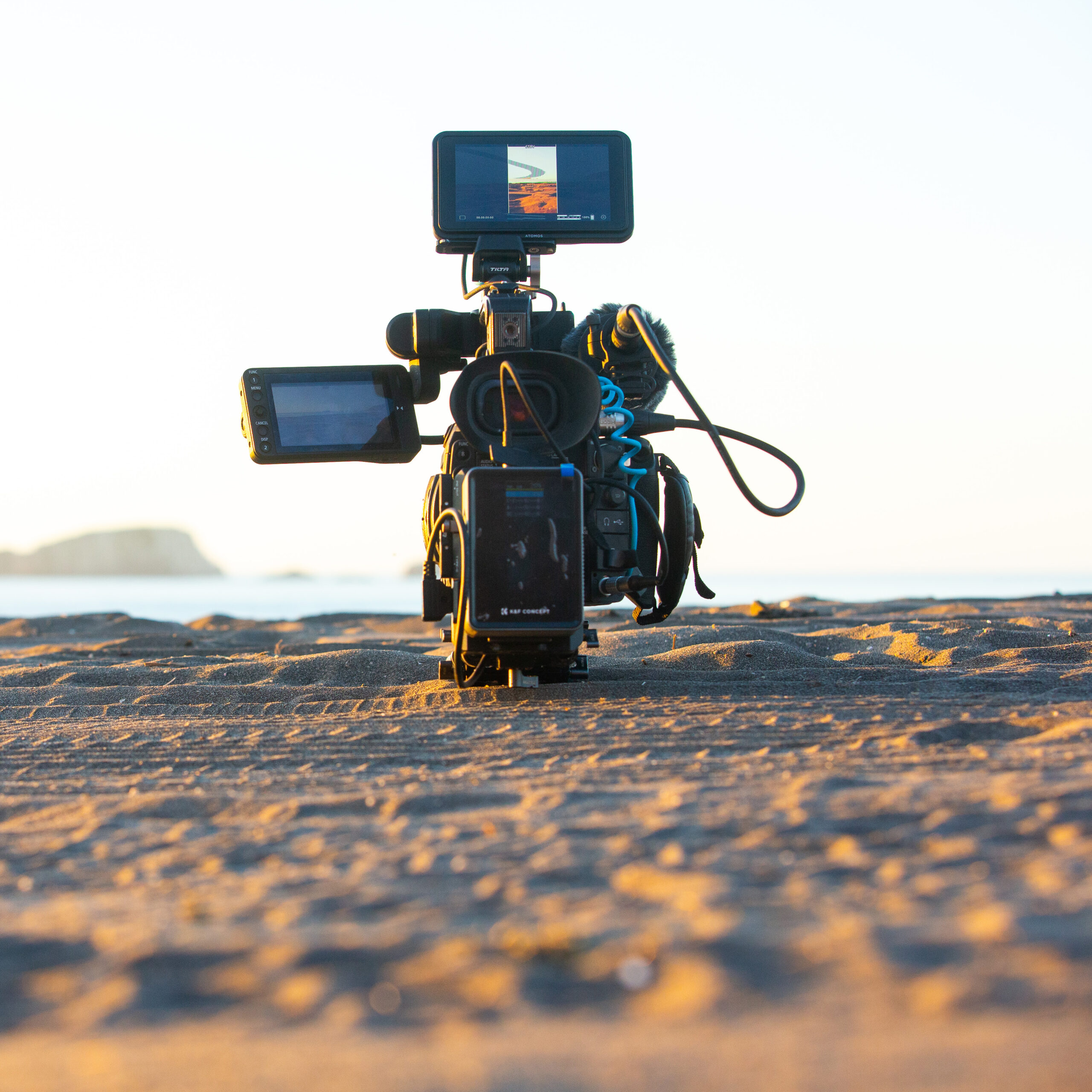 Behind-the-scenes view of a professional videographer’s setup — showcasing the heavy gear required for high-quality video production.
